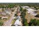 Street view of a neighborhood with tree-lined streets and a mix of residential and commercial properties at 7646 Covedale Dr, Orlando, FL 32818