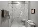 Elegant bathroom featuring a glass-enclosed marble shower and contemporary fixtures at 7675 Comrow St # 204, Kissimmee, FL 34747