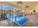 Exterior patio with a ping pong table and views of amenities at 7675 Comrow St # 204, Kissimmee, FL 34747