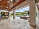 Outdoor living area featuring travertine flooring, comfortable seating, and a view of the pool at 8521 Lake Nona Shore Dr, Orlando, FL 32827