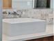 Close-up of a modern, square vessel sink with sleek, wall-mounted faucet at 8521 Lake Nona Shore Dr, Orlando, FL 32827