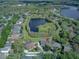 Overhead view of a well-maintained home with a spacious yard and mature trees at 876 Kensington Gardens Ct, Oviedo, FL 32765