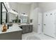 A well-lit bathroom featuring double sinks, modern fixtures, and stylish vanity at 876 Kensington Gardens Ct, Oviedo, FL 32765