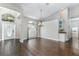 Bright dining area with hardwood floors, decorative lighting, and large windows at 876 Kensington Gardens Ct, Oviedo, FL 32765