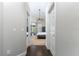 Hallway view showcases a bedroom with a ceiling fan, a dresser, and sliding glass doors to a patio at 876 Kensington Gardens Ct, Oviedo, FL 32765