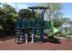 Multi-level playground structure with slide and climbing features, designed for outdoor activities at 876 Kensington Gardens Ct, Oviedo, FL 32765