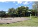 Community playground area featuring swings, play structures, and a soft wood chip ground cover at 876 Kensington Gardens Ct, Oviedo, FL 32765