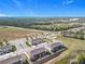 Aerial view of townhome community offering easy access to major roadways at 965 Lido Dr, Howey In The Hills, FL 34737