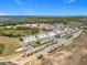 A beautiful aerial view of the community showcasing multiple houses in a well maintained neighborhood at 965 Lido Dr, Howey In The Hills, FL 34737