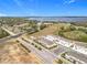 An aerial view of the community showcasing multiple houses in a well maintained neighborhood near a lake at 965 Lido Dr, Howey In The Hills, FL 34737