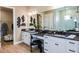 Modern bathroom with double sinks, vanity, and a large mirror at 985 Tassleflower Trl, St Cloud, FL 34771