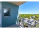 Balcony featuring a railing and a view of nearby trees at 10 N Summerlin Ave # 55, Orlando, FL 32801