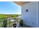 Outdoor balcony with potted plants and a view of lush green trees at 10 N Summerlin Ave # 55, Orlando, FL 32801