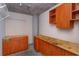 Spacious storage area featuring wooden cabinets and open shelving for organization and ample storage solutions at 10 N Summerlin Ave # 55, Orlando, FL 32801