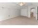 Large, carpeted room, featuring a closet and open doorway at 1019 Spring Landing Dr, Winter Garden, FL 34787