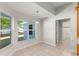 Charming breakfast nook with large windows and pendant lighting, adjacent to laundry room at 1019 Spring Landing Dr, Winter Garden, FL 34787