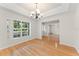 Bright dining room with hardwood floors and large window at 1019 Spring Landing Dr, Winter Garden, FL 34787