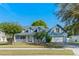 Charming two-story blue home with a well-manicured lawn and inviting front porch at 1019 Spring Landing Dr, Winter Garden, FL 34787