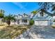 Charming two-story blue home with a manicured lawn and two-car garage at 1019 Spring Landing Dr, Winter Garden, FL 34787