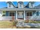 Charming home entrance with a white porch railing, brick walkway, and manicured plants at 1019 Spring Landing Dr, Winter Garden, FL 34787