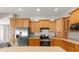 Kitchen with wood cabinets and stainless steel appliances at 1019 Spring Landing Dr, Winter Garden, FL 34787