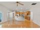 Open-concept kitchen with natural wood cabinets and stainless steel appliances at 1019 Spring Landing Dr, Winter Garden, FL 34787