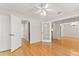 Spacious living room featuring hardwood floors and a ceiling fan at 1019 Spring Landing Dr, Winter Garden, FL 34787