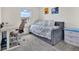 Bedroom with neutral walls, a daybed and a dedicated workspace at 11038 Leafshore Loop, Orlando, FL 32829