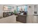 Cozy living room features a comfortable sectional sofa, tile floors, and natural light at 11038 Leafshore Loop, Orlando, FL 32829