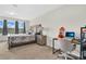 Bright main bedroom with neutral walls features a work space and large windows at 11038 Leafshore Loop, Orlando, FL 32829