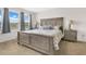Serene main bedroom with a comfortable bed, soft carpet, and natural light at 11038 Leafshore Loop, Orlando, FL 32829