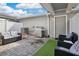 Outdoor patio with comfortable seating and a stainless steel grill at 11038 Leafshore Loop, Orlando, FL 32829