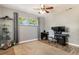 Bedroom with grey walls and a ceiling fan being used as an office at 115 Shepherd Trl, Longwood, FL 32750