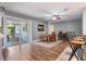 Dining area with hardwood floors leading to a covered patio via sliding glass doors at 115 Shepherd Trl, Longwood, FL 32750