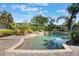 Sparkling in-ground pool surrounded by a brick patio and lush landscaping at 115 Shepherd Trl, Longwood, FL 32750