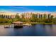 Stunning aerial view of the property with a lake, gazebo, boat dock, and lush landscaping at 14501 Grove Resort Ave # 1229, Winter Garden, FL 34787