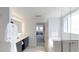 Sleek bathroom featuring a double vanity, soaking tub, glass shower, and stylish fixtures at 14501 Grove Resort Ave # 1229, Winter Garden, FL 34787