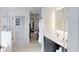 Modern bathroom with a glass-enclosed shower, sleek vanity, and a walk-in closet at 14501 Grove Resort Ave # 1229, Winter Garden, FL 34787