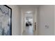 Inviting hallway leading to a bright living space with modern decor and a comfortable seating area at 14501 Grove Resort Ave # 1229, Winter Garden, FL 34787