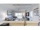 Bright living room with a comfortable sectional sofa, dining area, and access to a balcony at 14501 Grove Resort Ave # 1229, Winter Garden, FL 34787