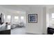 Inviting living room with seating area, multiple windows with views, and contemporary furnishings at 14501 Grove Resort Ave # 1229, Winter Garden, FL 34787