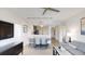 Open-concept living space with a dining area, a modern kitchen, and a comfortable seating arrangement at 14501 Grove Resort Ave # 1229, Winter Garden, FL 34787