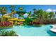 Thrilling water slides at the pool, surrounded by tropical landscaping, promising an exciting and adventurous experience at 14501 Grove Resort Ave # 1229, Winter Garden, FL 34787