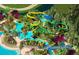 This aerial view features a waterpark with waterslides, a lazy river, and lounge chairs at 14501 Grove Resort Ave # 1229, Winter Garden, FL 34787