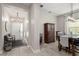 Inviting entryway with a chandelier, bench seating, and a view into the dining area, showcasing a warm welcome at 14661 Glade Hill Park Way, Winter Garden, FL 34787