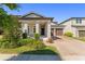 Charming single-Gathering home with a well-manicured lawn and inviting front porch at 14661 Glade Hill Park Way, Winter Garden, FL 34787