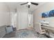 Inviting living area featuring a ceiling fan, and a view of an ensuite bathroom at 14661 Glade Hill Park Way, Winter Garden, FL 34787