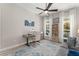 Bright living room with natural light, neutral decor, and a ceiling fan at 14661 Glade Hill Park Way, Winter Garden, FL 34787