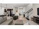 Bright and airy living room with open layout and neutral tones, flowing into the kitchen at 14661 Glade Hill Park Way, Winter Garden, FL 34787