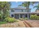 Stunning backyard showcasing lush greenery, a stone patio, and a charming water feature at 1923 Osman Ave, Orlando, FL 32806